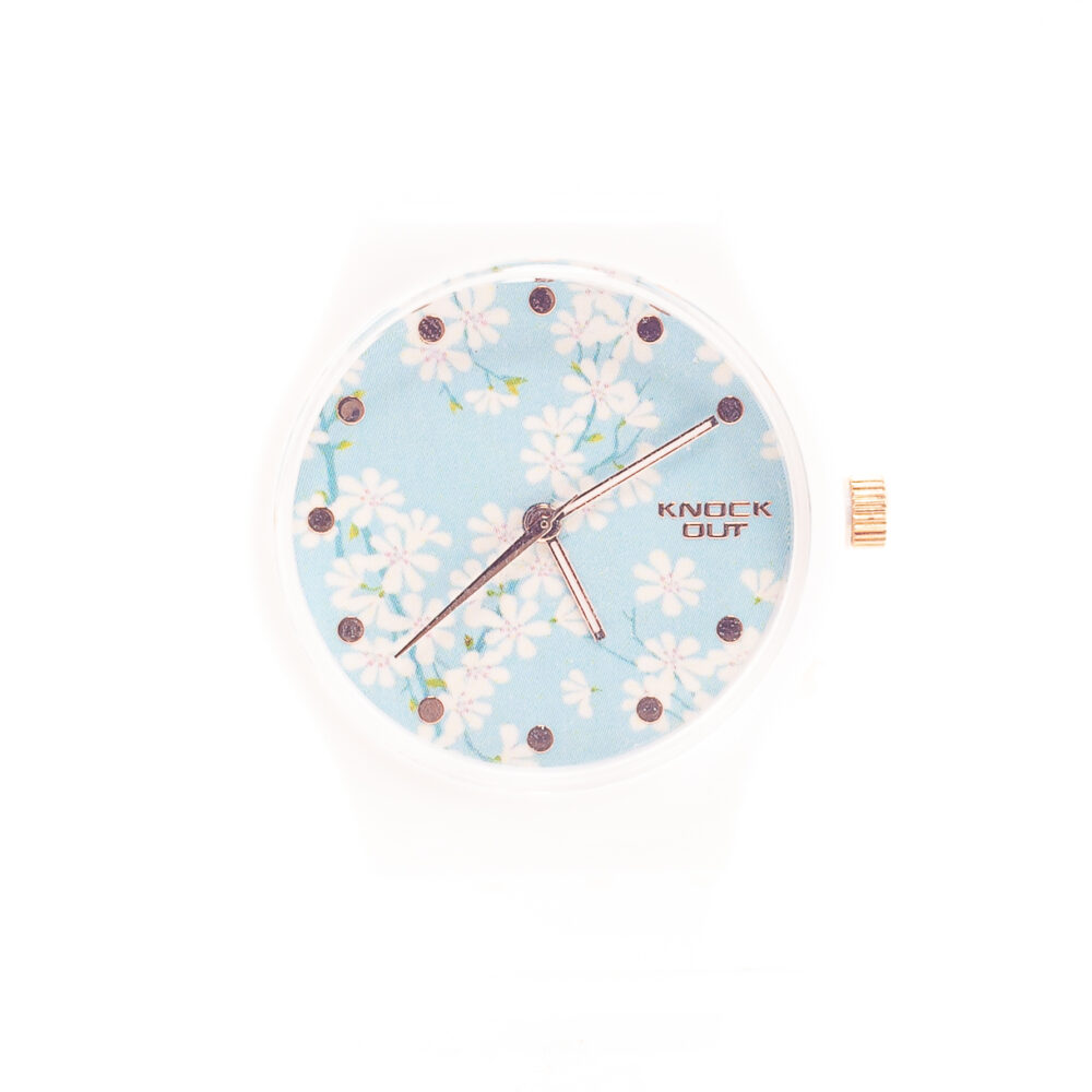 RELOJ KNOCK OUT DE GOMA BLANCA CON FONDO CELESTE FLOREADO